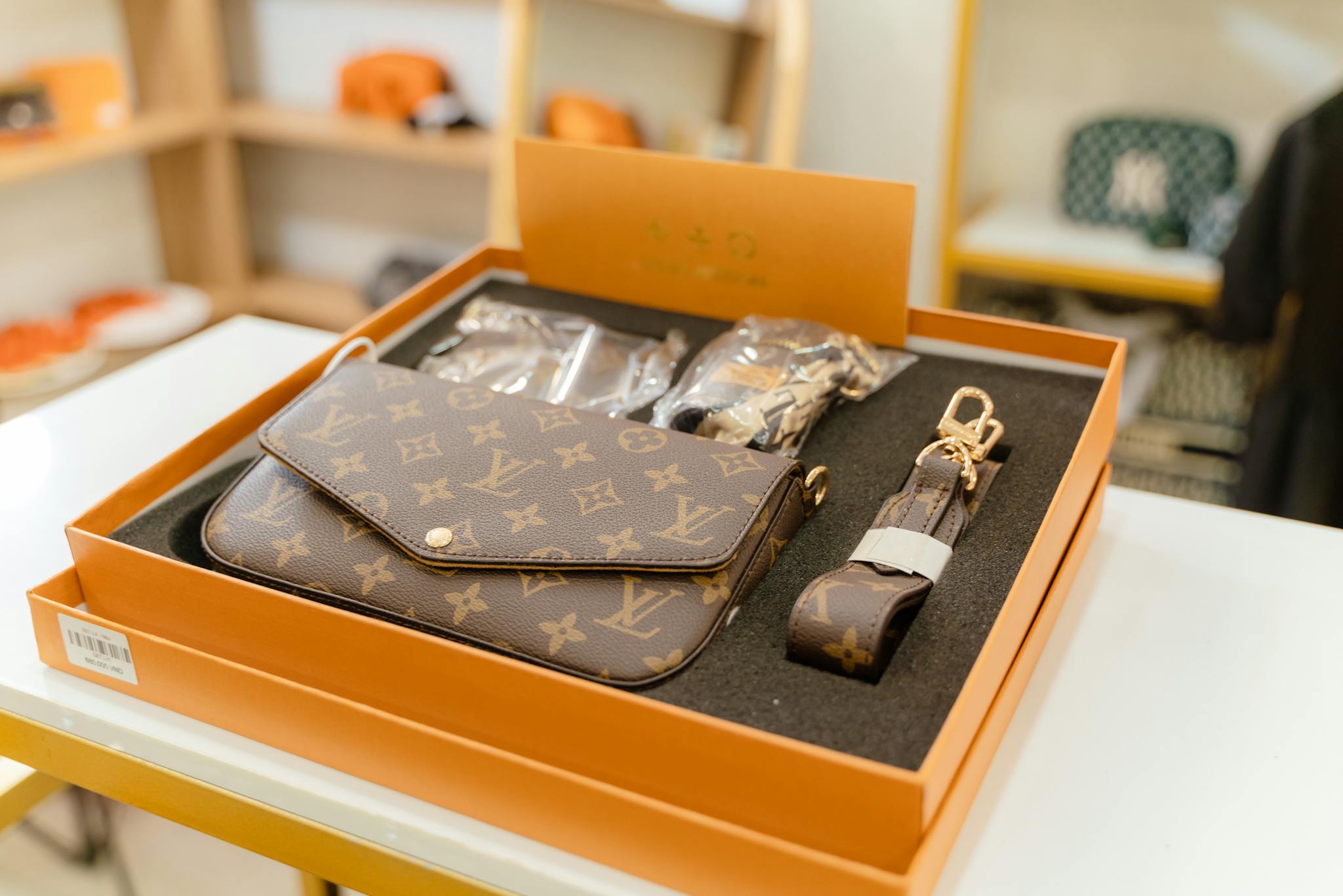 High-end Louis Vuitton monogram bag set displayed in a luxury boutique.